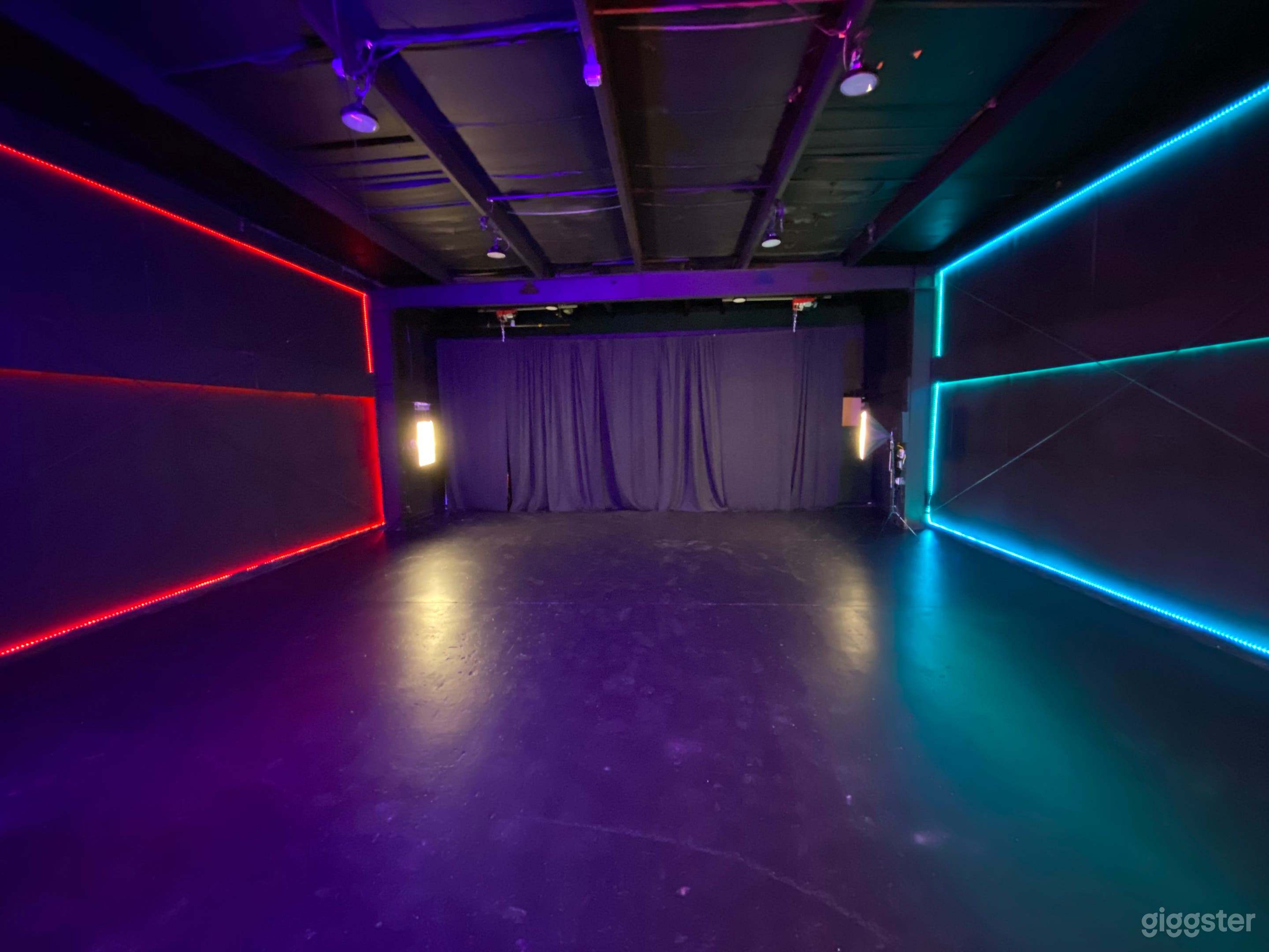 Large performance, pre production area. 30x30 black box with motorized pipe and drape in the rear. Exposed steel beams allow the use of beam clamps to bring any idea to life. 
-Set the mood with led accent walls that can be changed to any color