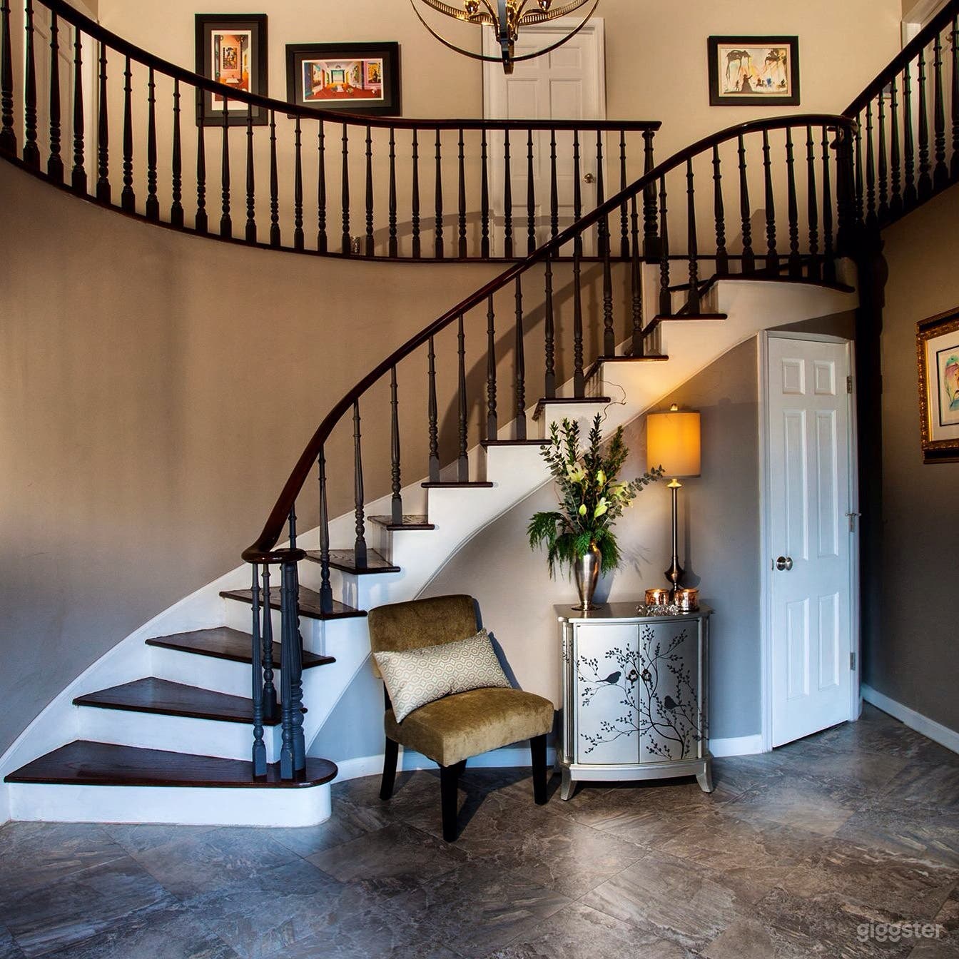 Elegant entry with sweeping staircase 