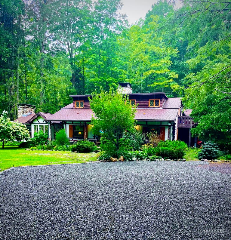  Blue Heron Hollow. Three acre estate with guest cottage, two ponds, waterfalls, and enchanting creek running through the private scenic grounds. 