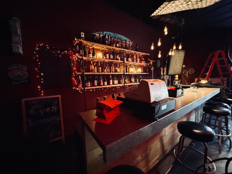  Dark Retro Dive Bar With Booths and Liquor Wall 