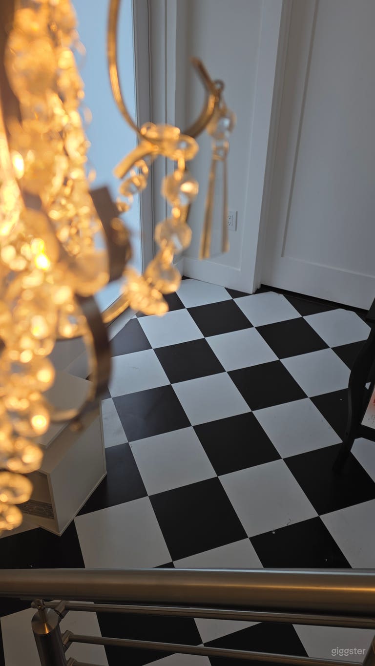  Le Foyer. Statement entrance featuring iconic harlequin floors and grand visual impact. Perfect as an arrival shot, fashion reveal, dramatic transition scene, or editorial opener. 