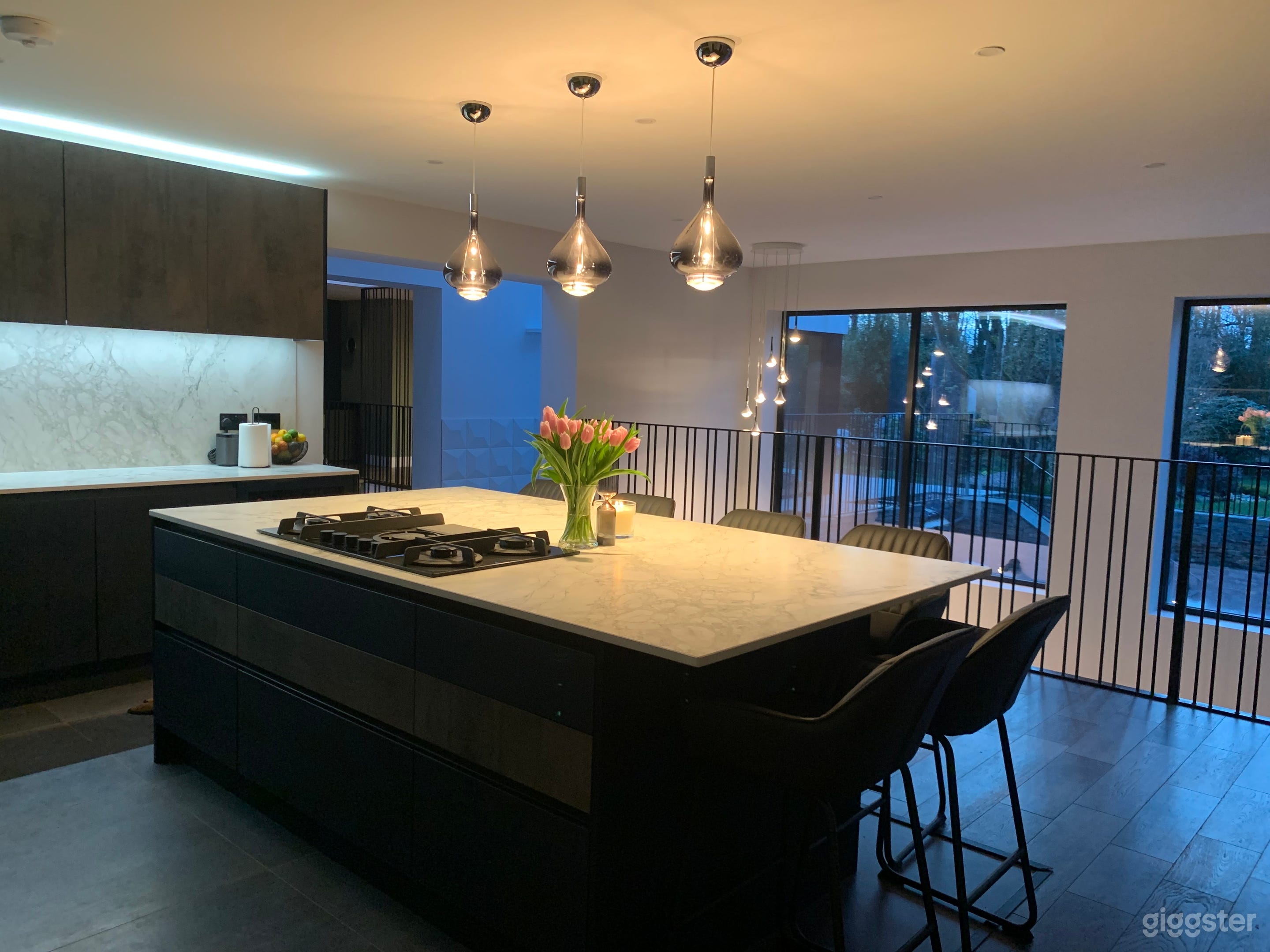 Kitchen look out over sunken courtyard and garden