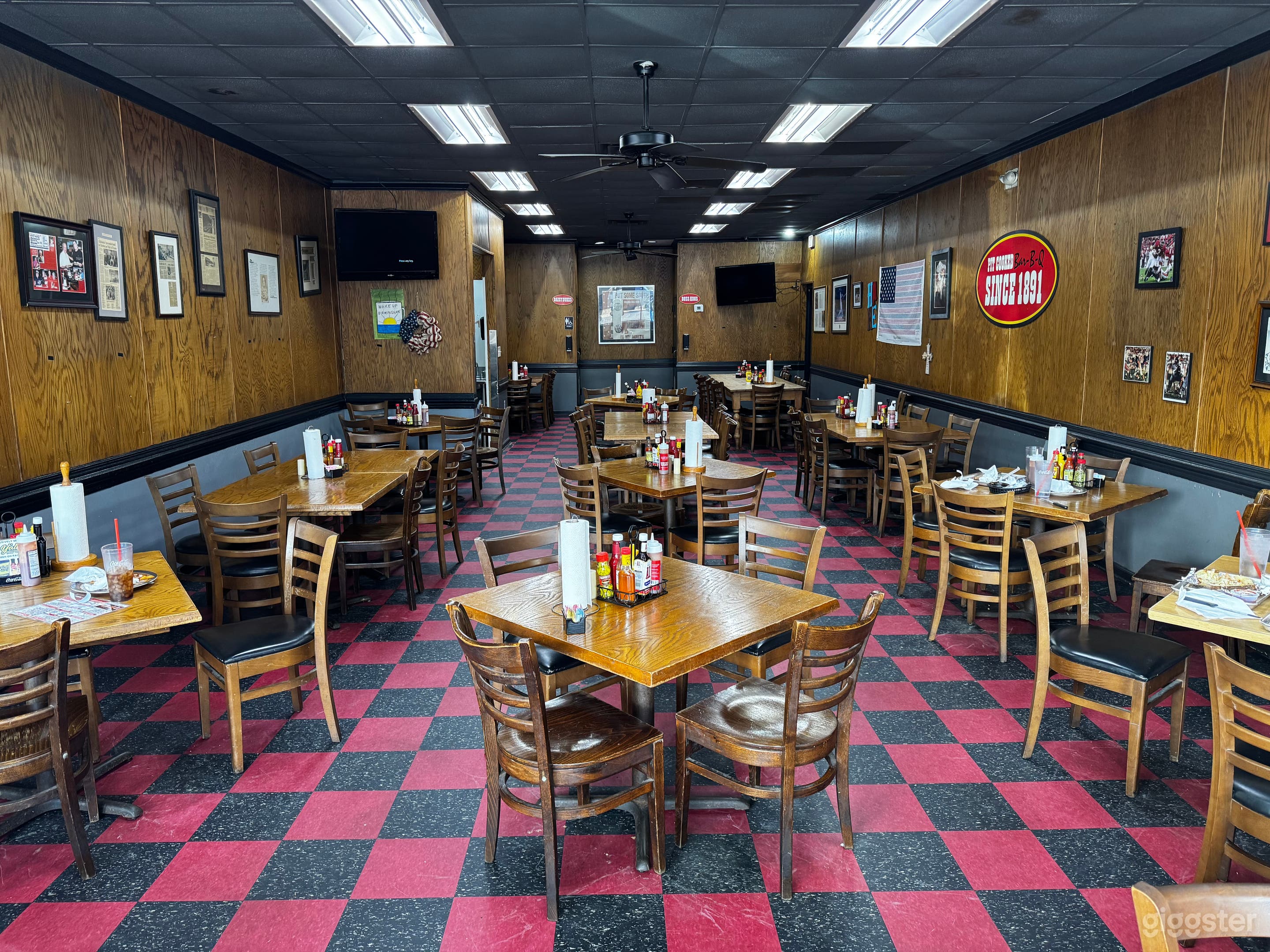 The big dining room with red and black checkered floors