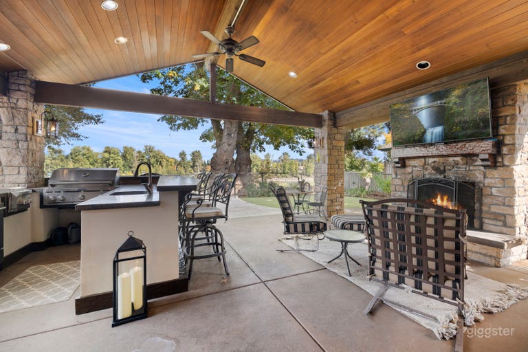  Outdoor kitchen with fireplace, outdoor tv and room for friends, a party, or whatever you can imagine. 