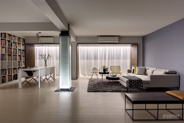  Night shot of Living and Dining with lighted column lantern glowing. 