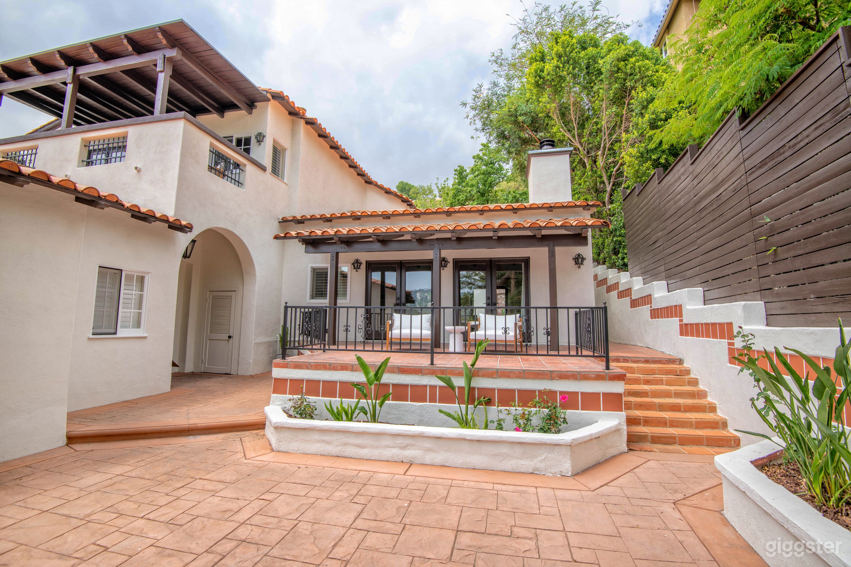 Extra large patio with lush landscaping. 