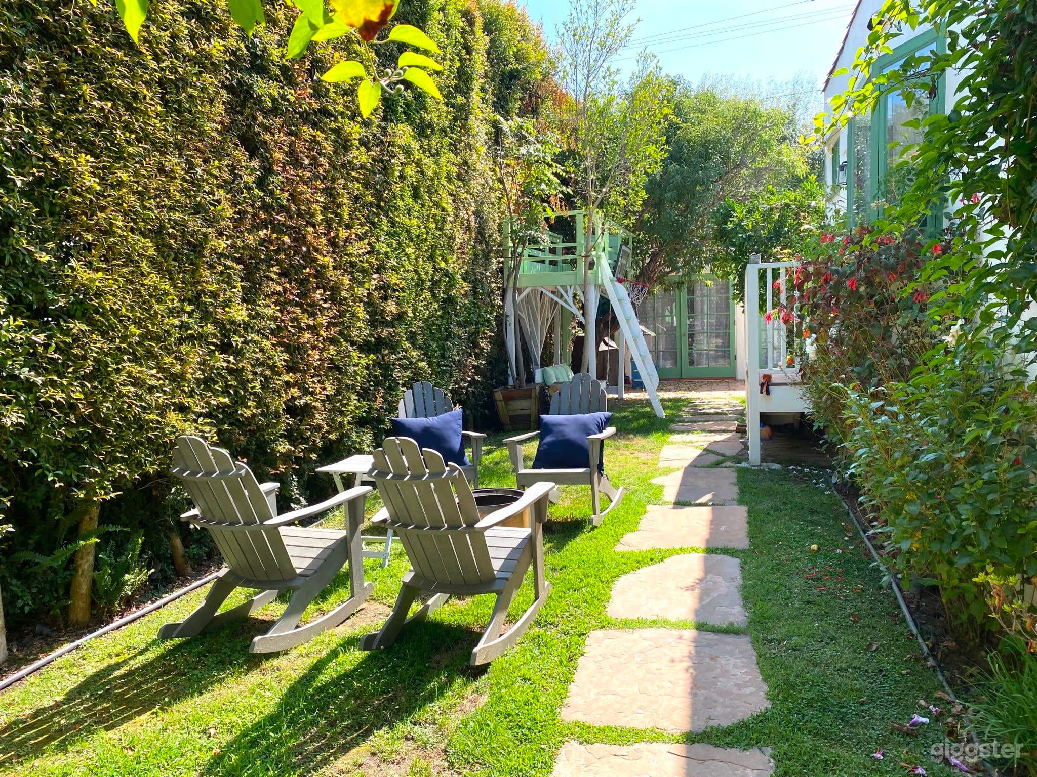 Enchanting Spanish-Style Home with Lush Greenery and Treehouse Photo 4