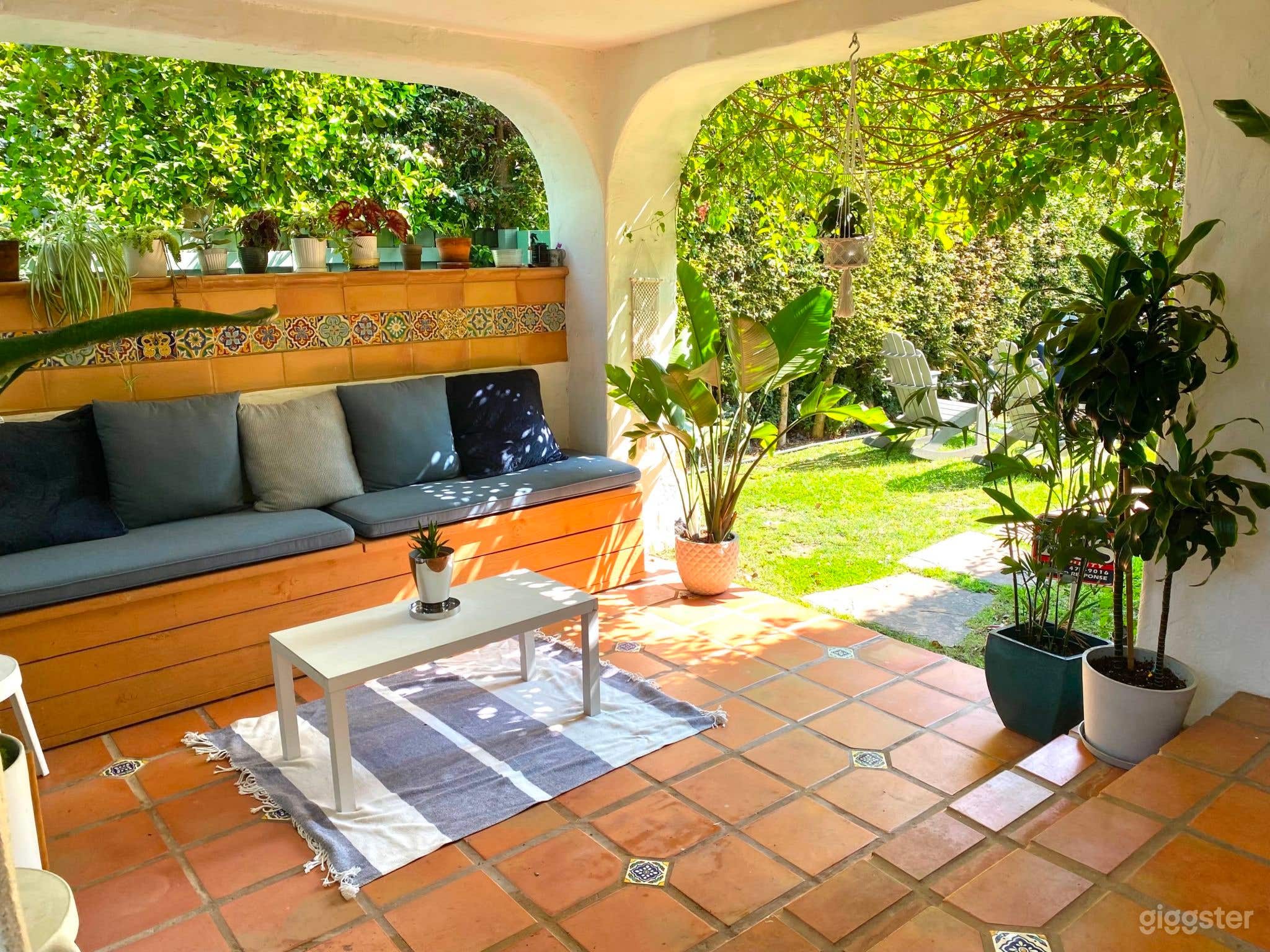 Enchanting Spanish-Style Home with Lush Greenery and Treehouse Photo 2