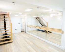  Fitness Studio with long mirror and barre 