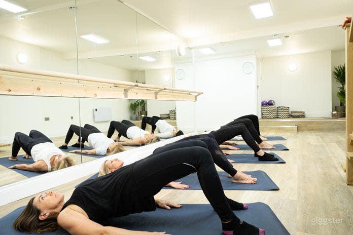  Fitness Studio with long mirror and barre 