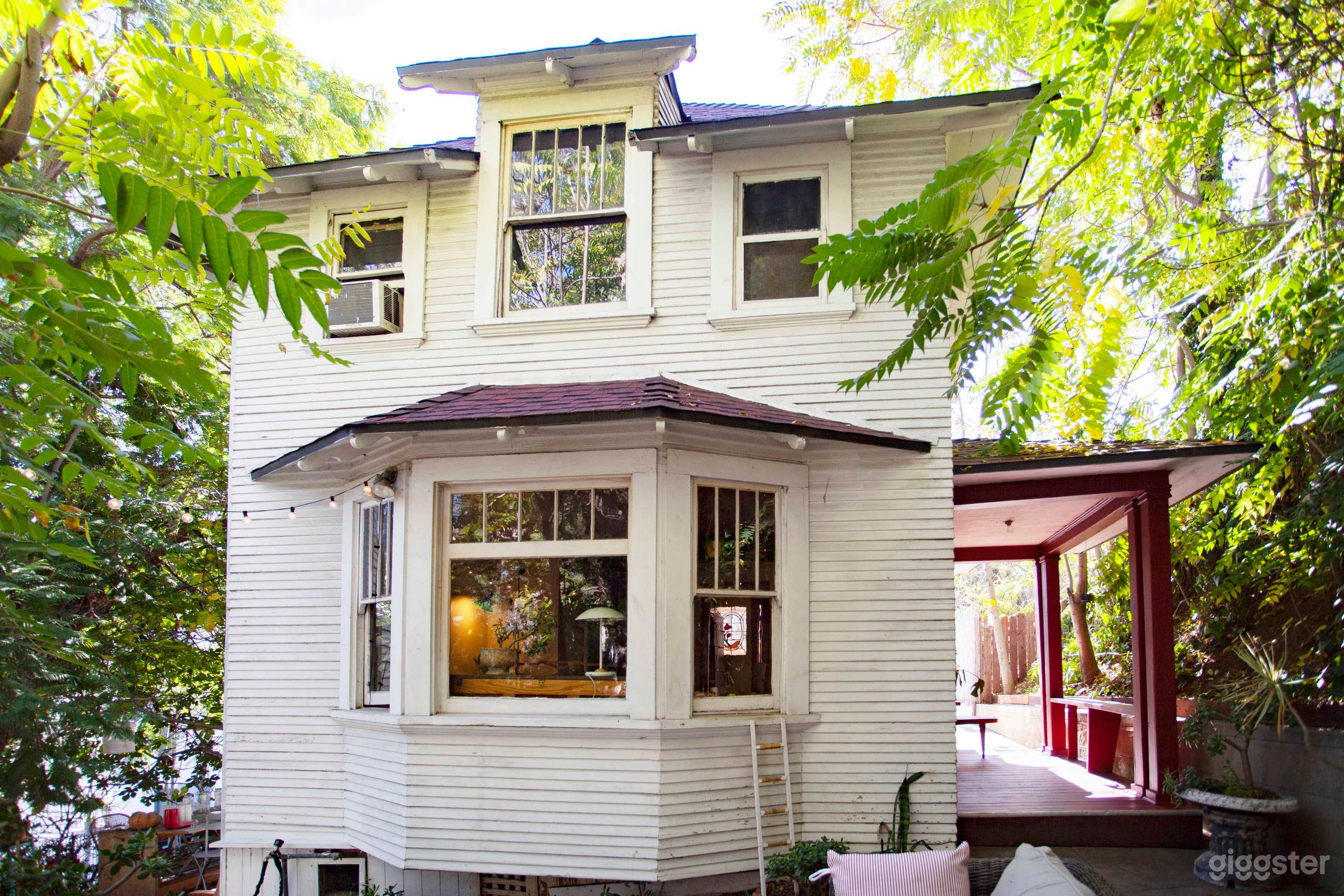 Leafy exterior Victorian home with trendy interior Photo 1