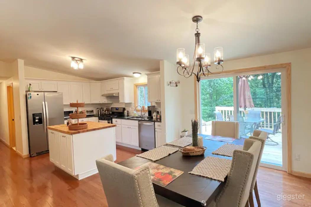 open floorplan with dining room flowing into the kitchen and onto the deck and living room.