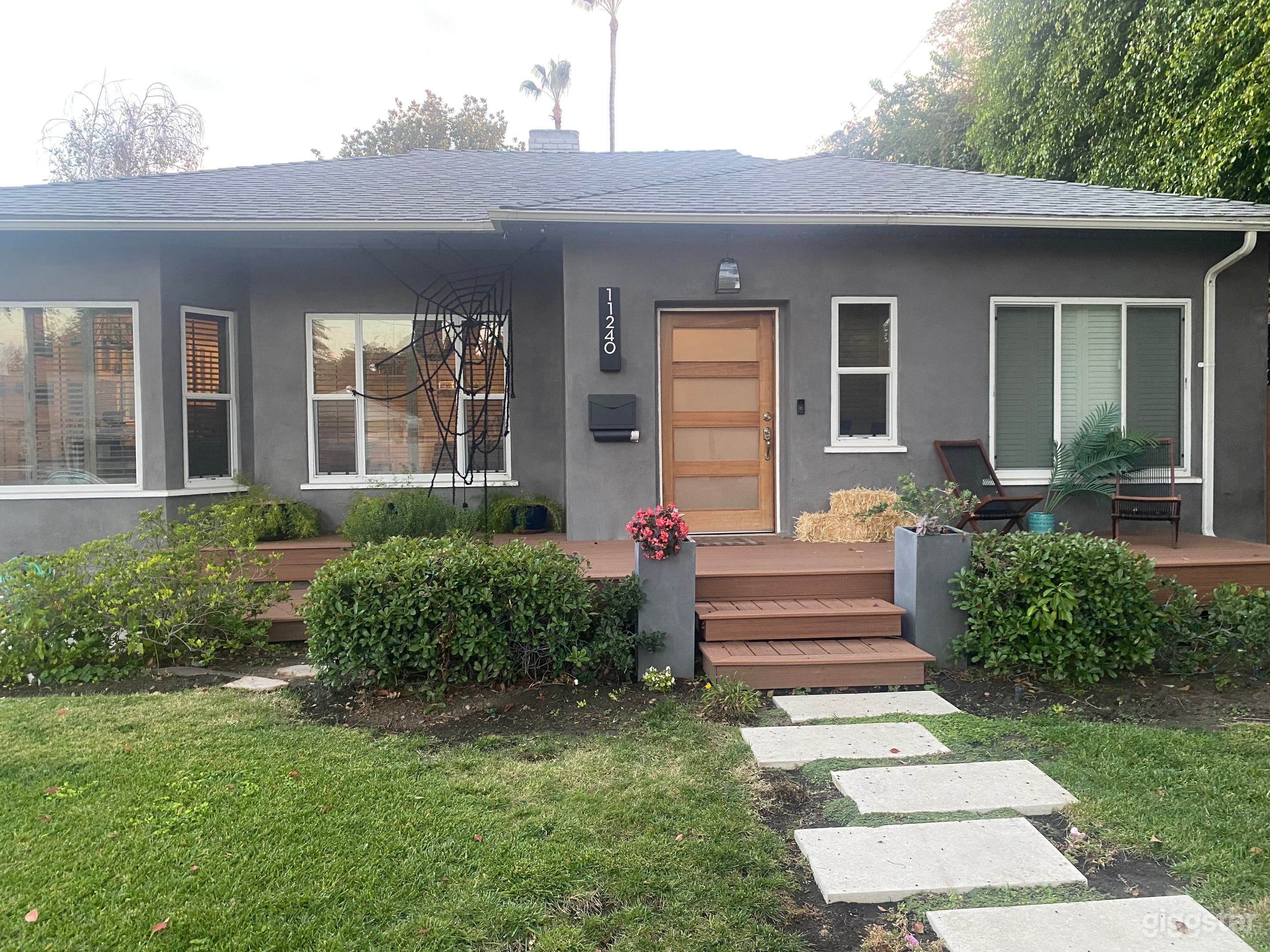 Directly front of house shows porch and door.