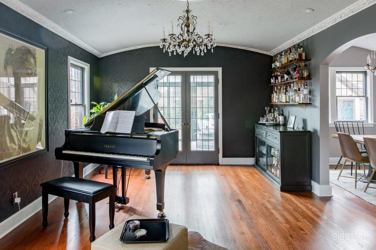  Formal dining room now turned into music room and bar lounge. Grand Yamaha piano, large dry bar with selection of glassware and bottles, vintage 1950s Motorola record console and more. 