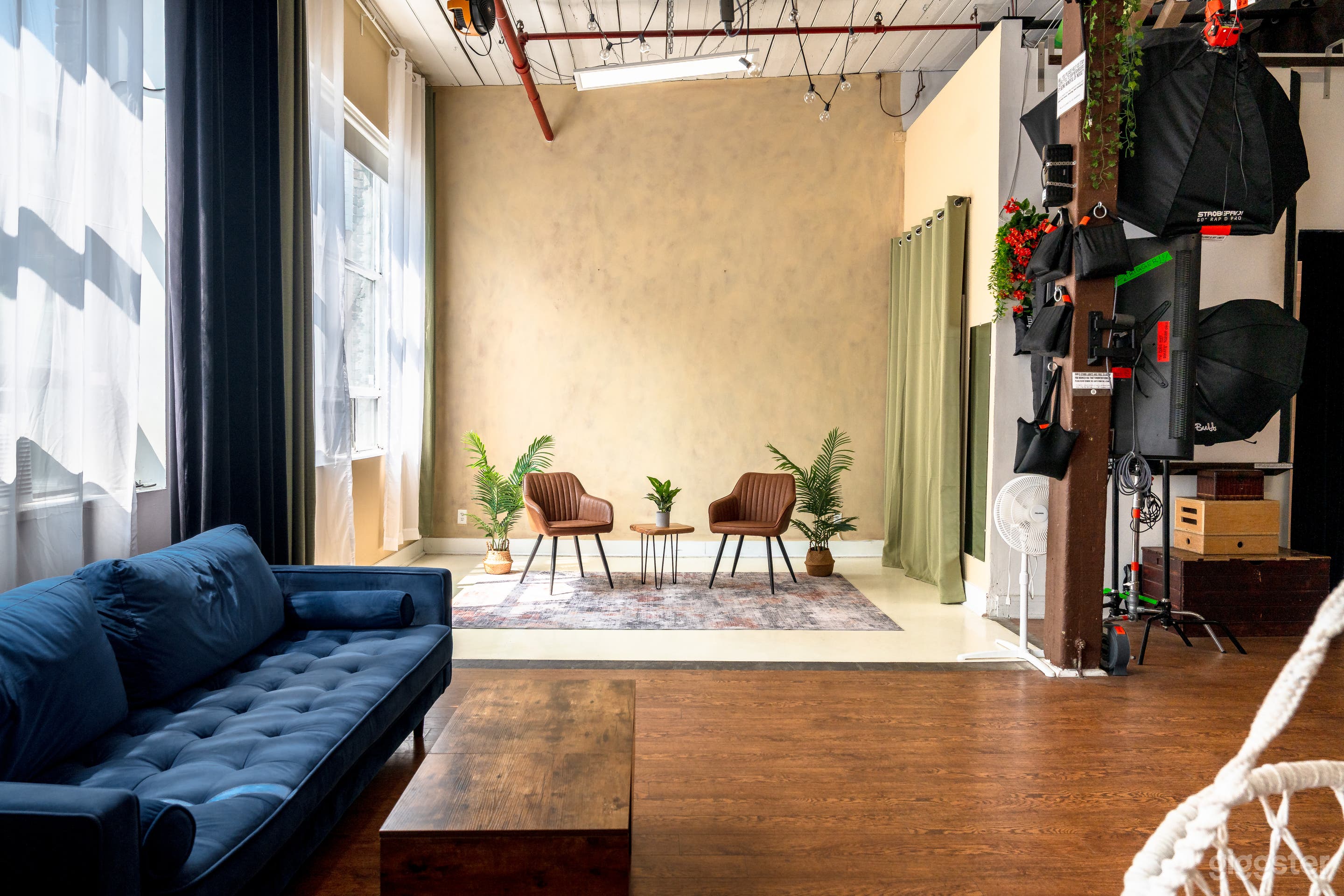 Podcasting interview set in earthy toned modern room with white floor