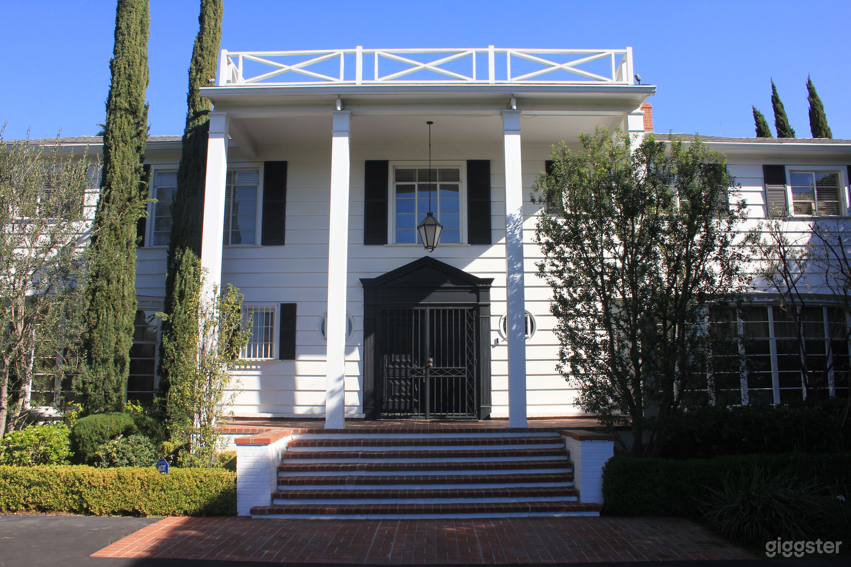Georgian Colonial Mansion with Hedges &amp; Pillars Photo 1