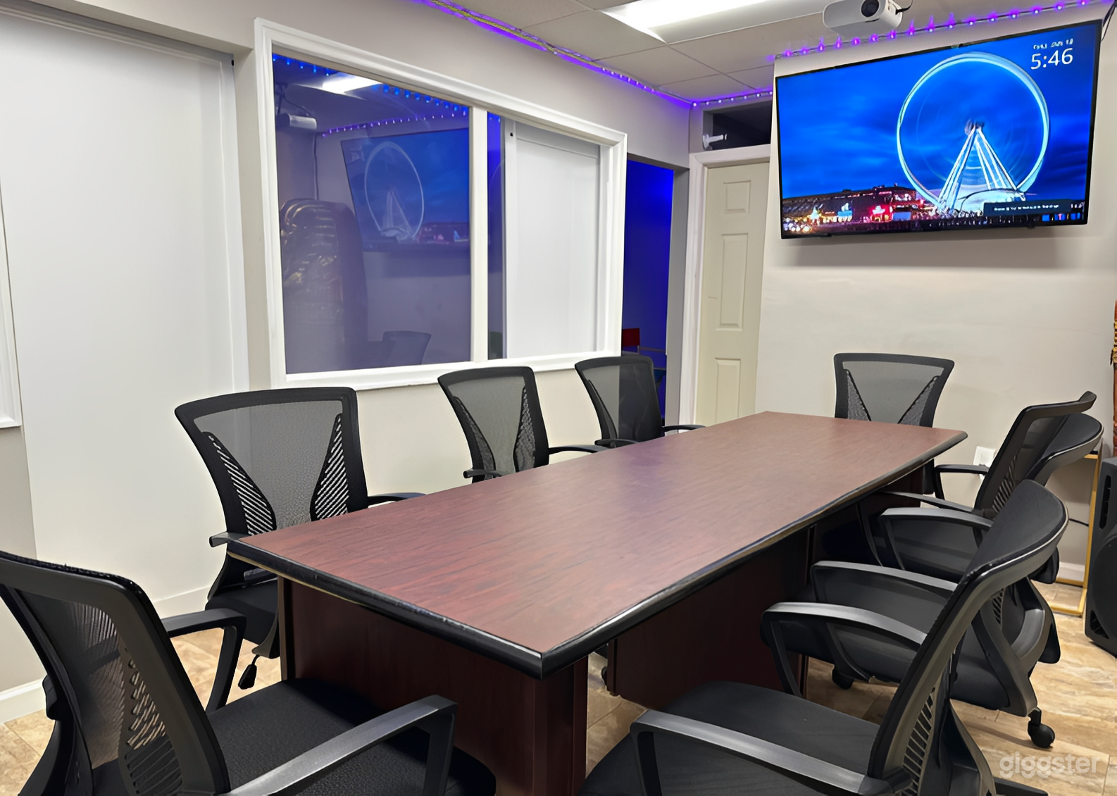 Modern Conference Room with LED Lighting & Large Screen Photo 1