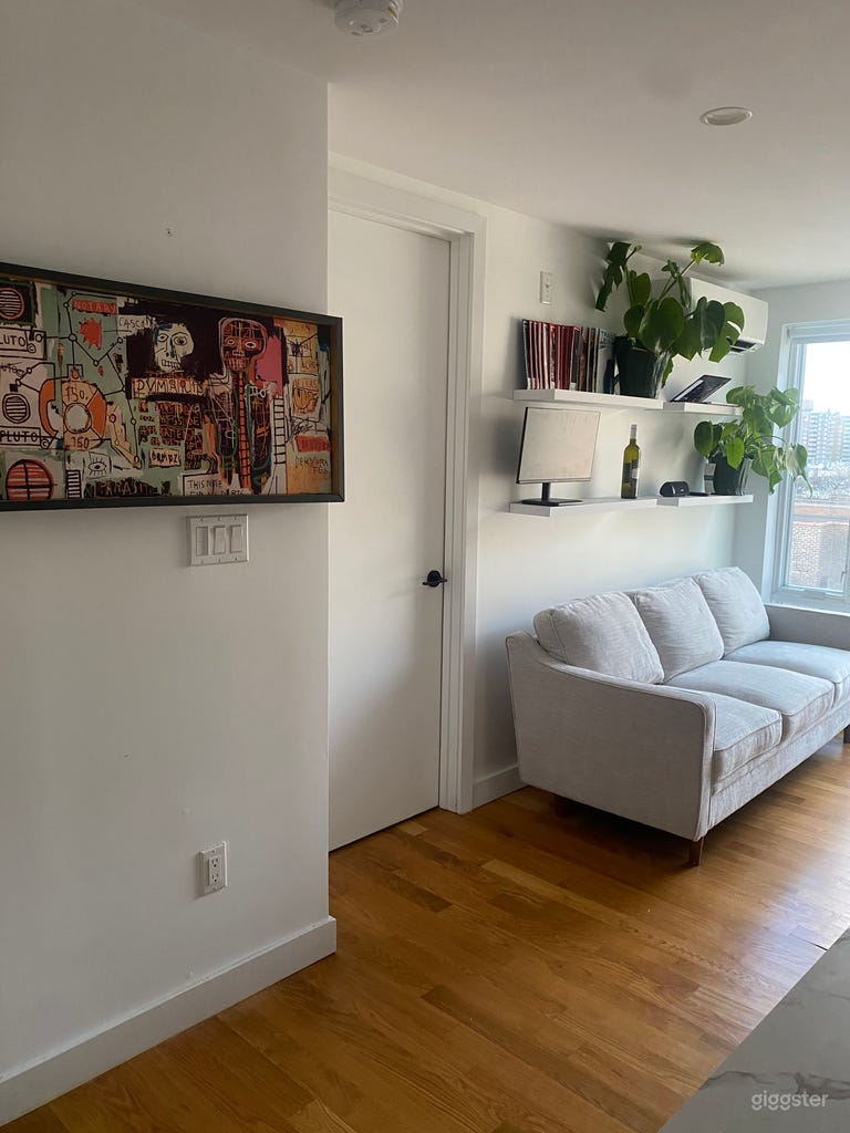  A minimally furnished living room, with the option to rearrange the furniture as needed. 