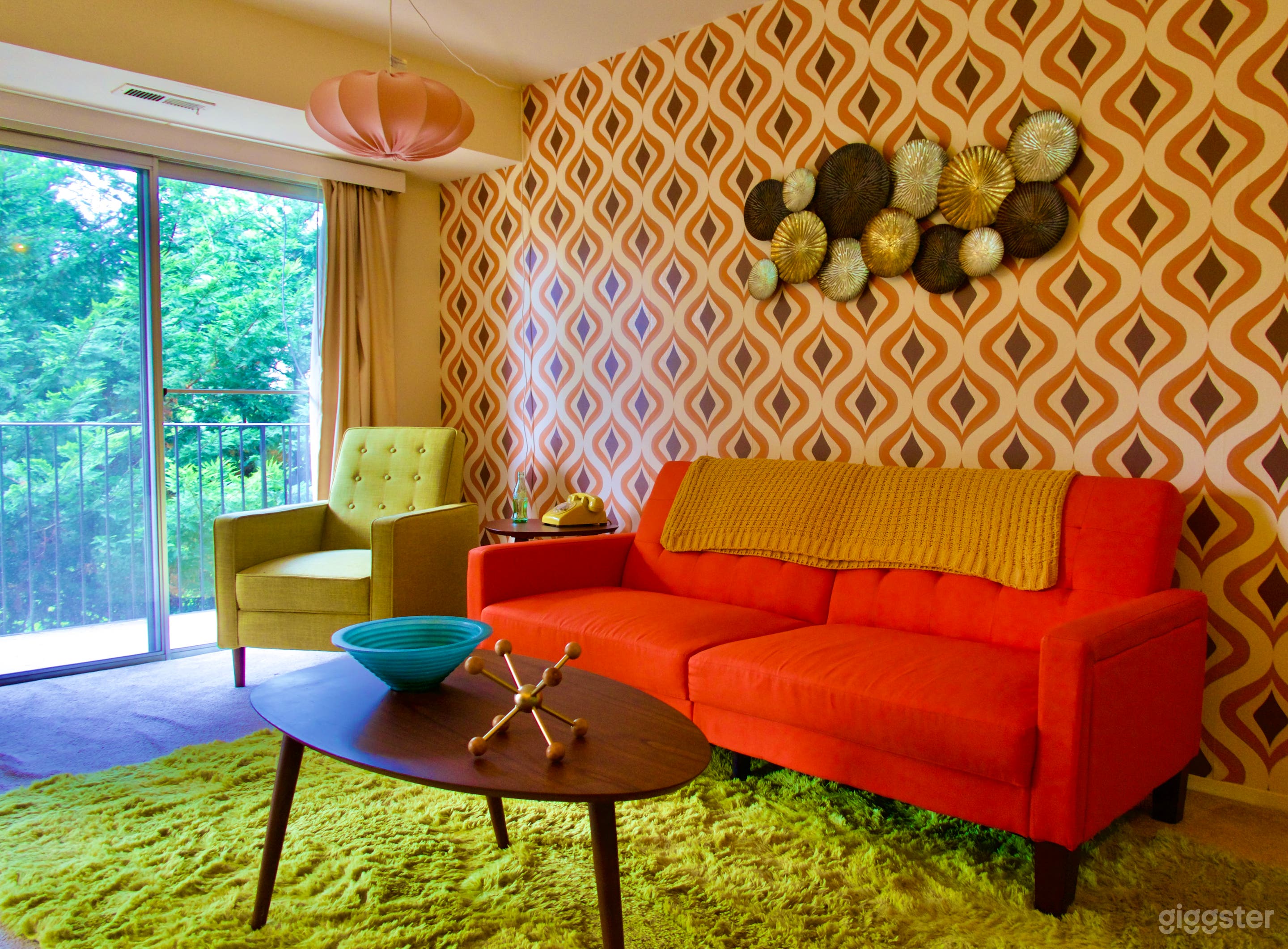 Wallpapered Wall, Sofa, and Chair with Natural Light