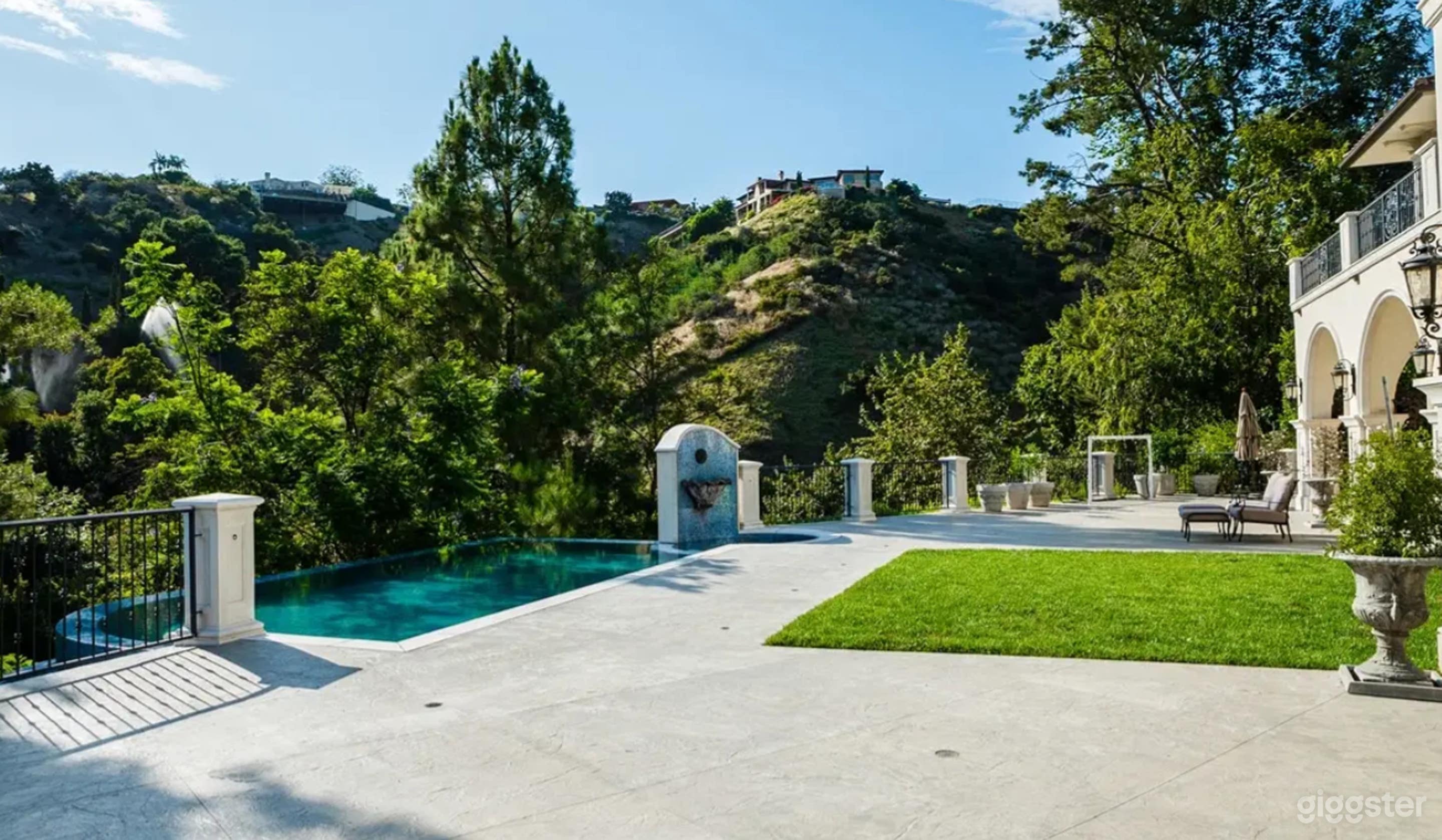 Elegant Infinity Pool & Jacuzzi with Fountain Feature Photo 3