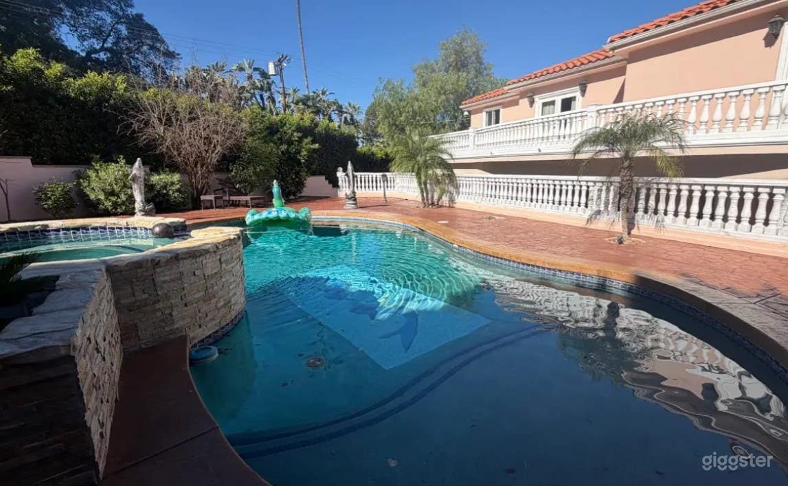 Resort Style Pool with Spacious Patio Photo 4