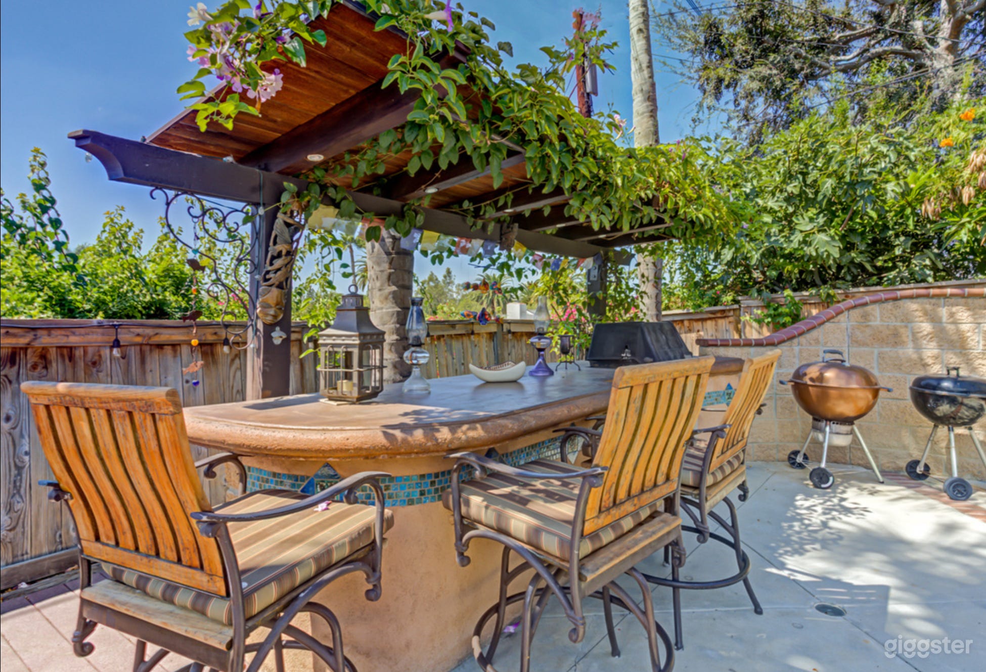 Stunning outside bar and palapa with seating for three and refrigerator.