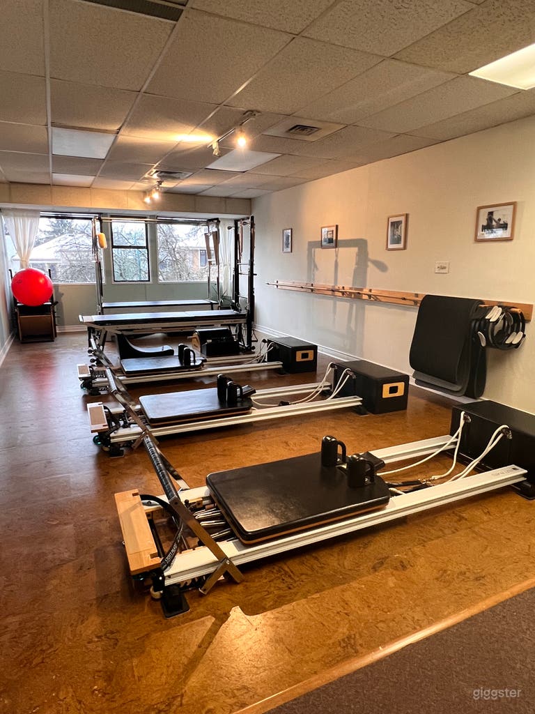  Equipped with 4 Stott Reformers (1 is a tower combo), 1 Contrology Cadillac, Ballet Bar and Pilates Chair. Lots of balls, props, and thick Pilates mats. 