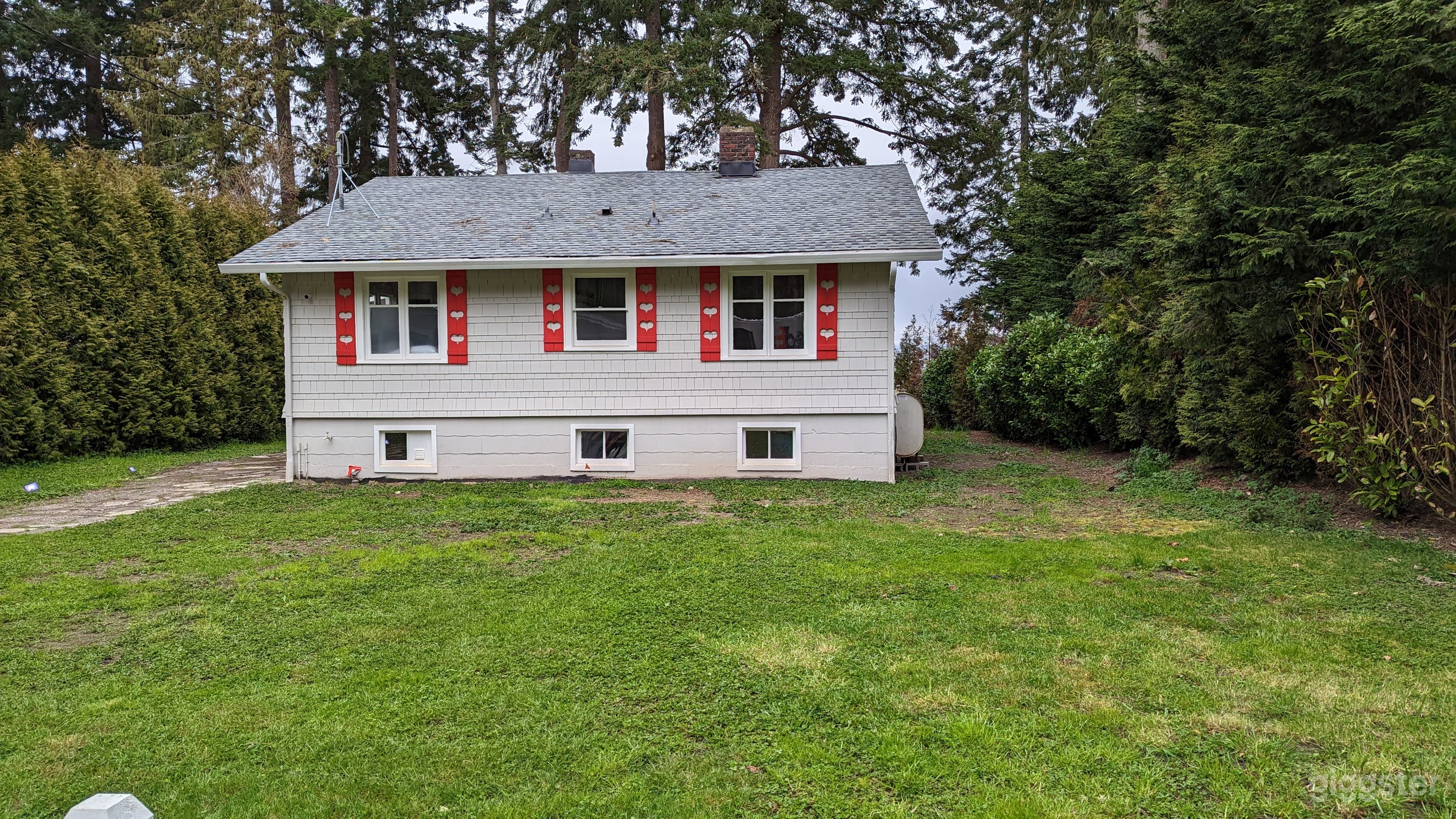 Our adorable 100-year-old beach cottage looking out at the water. Large grassy area available for temporary deck, dance floor, etc. 