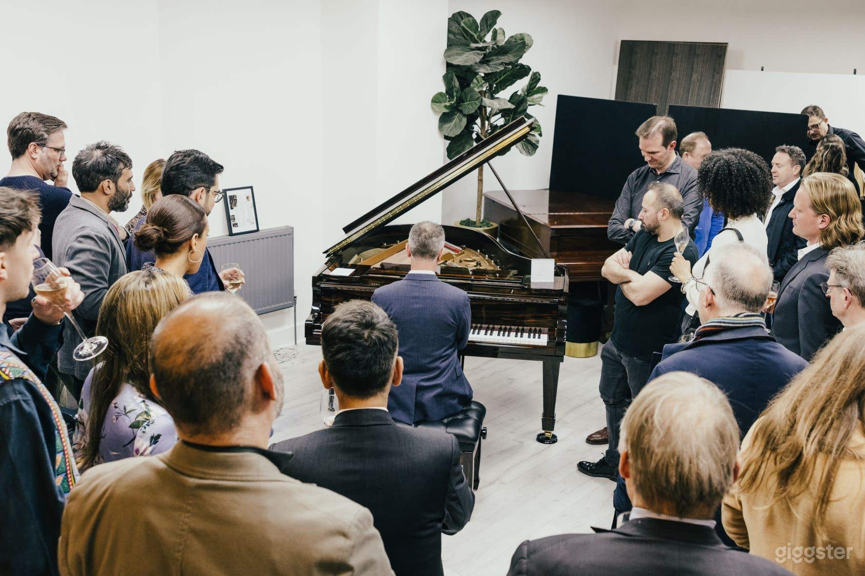 An audience at the piano showroom