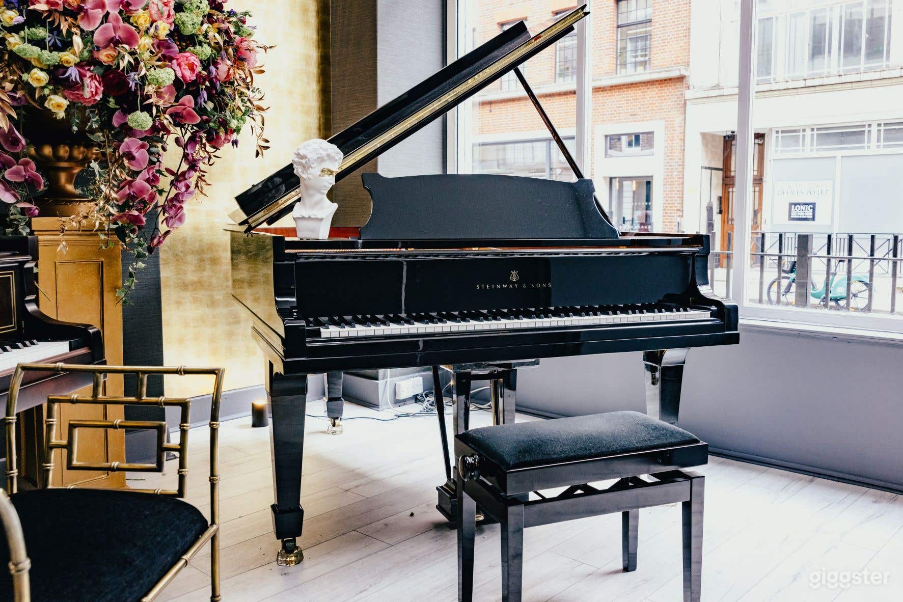 Steinway grand piano in the window of the showroom