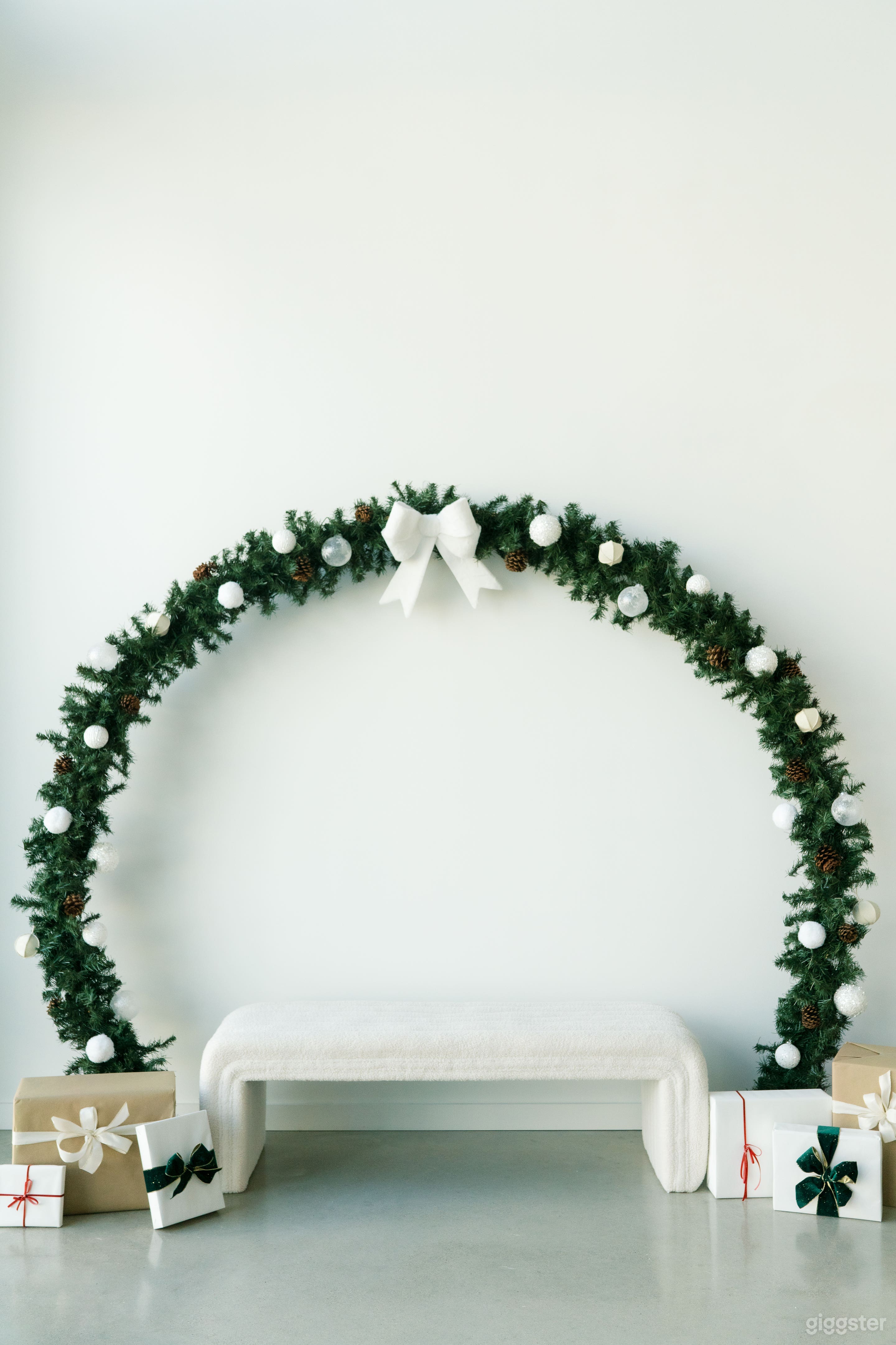 One of our holiday styled sets > Our 8 foot wreath scene with 2 seating options - now until Nov 26th!
