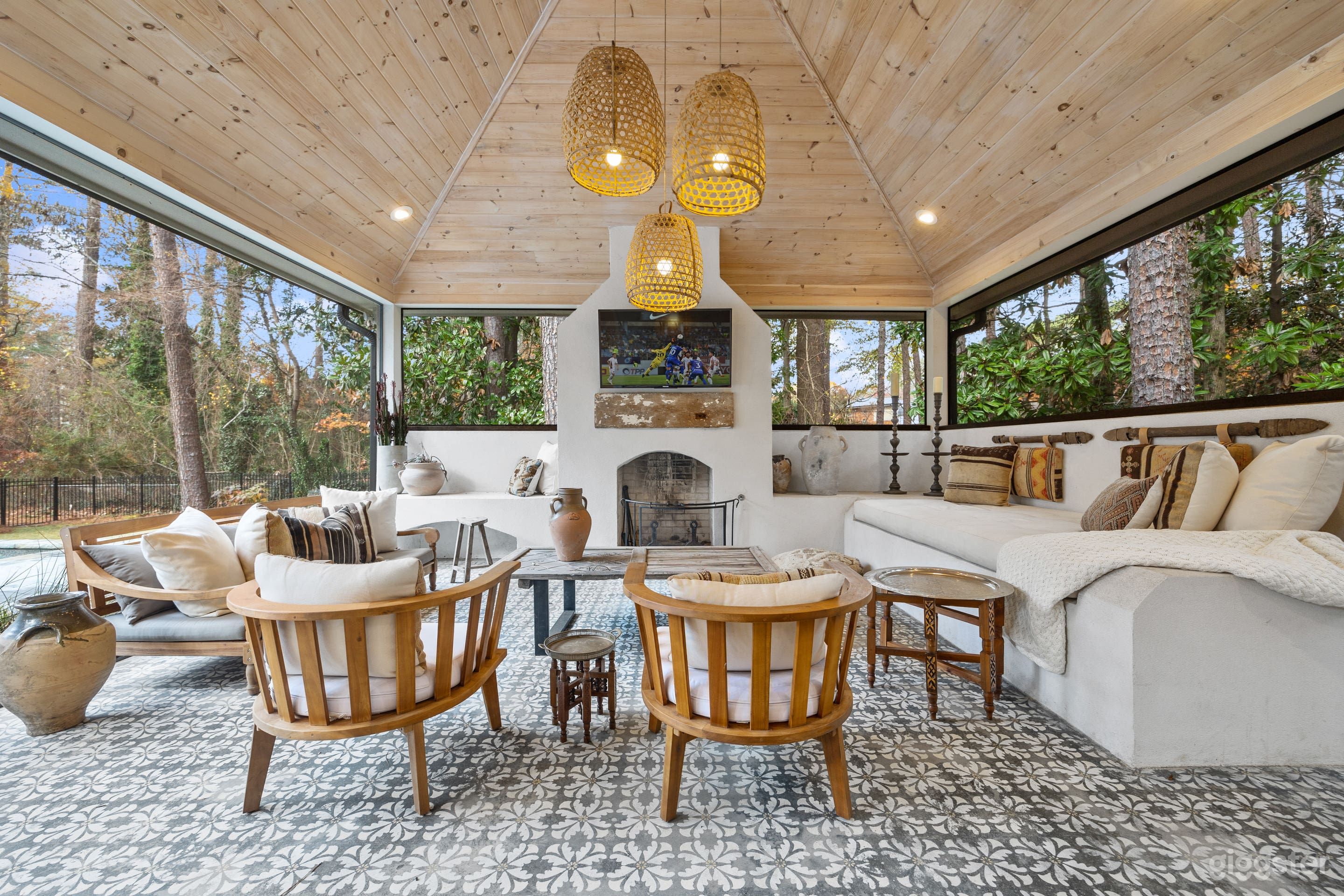 Enjoy the beautiful weather in this outdoor oasis. Vaulted wood ceiling with wood burning fireplace.  Built after a trip overseas to mirror Morocco. 