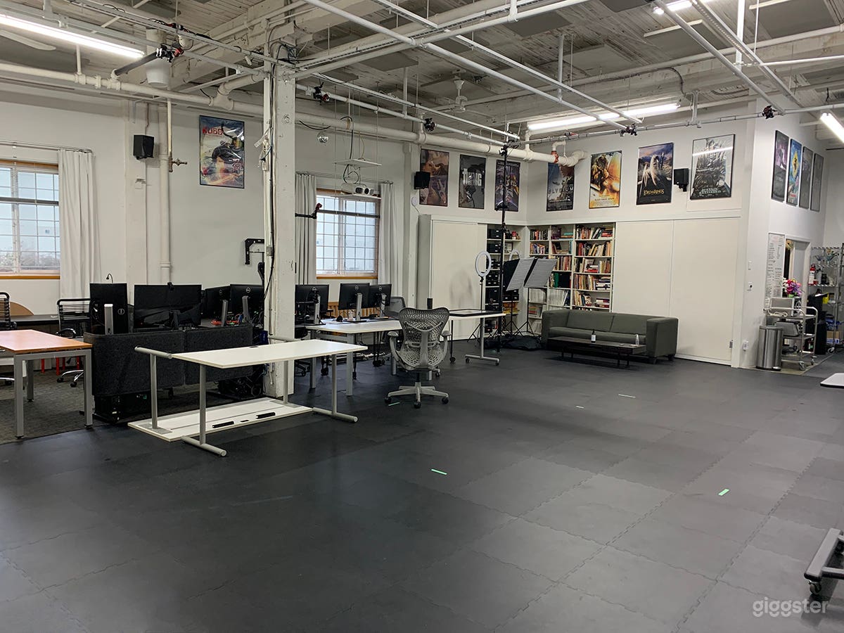 Sliding acoustic panels exposing Library Bookcase Wall