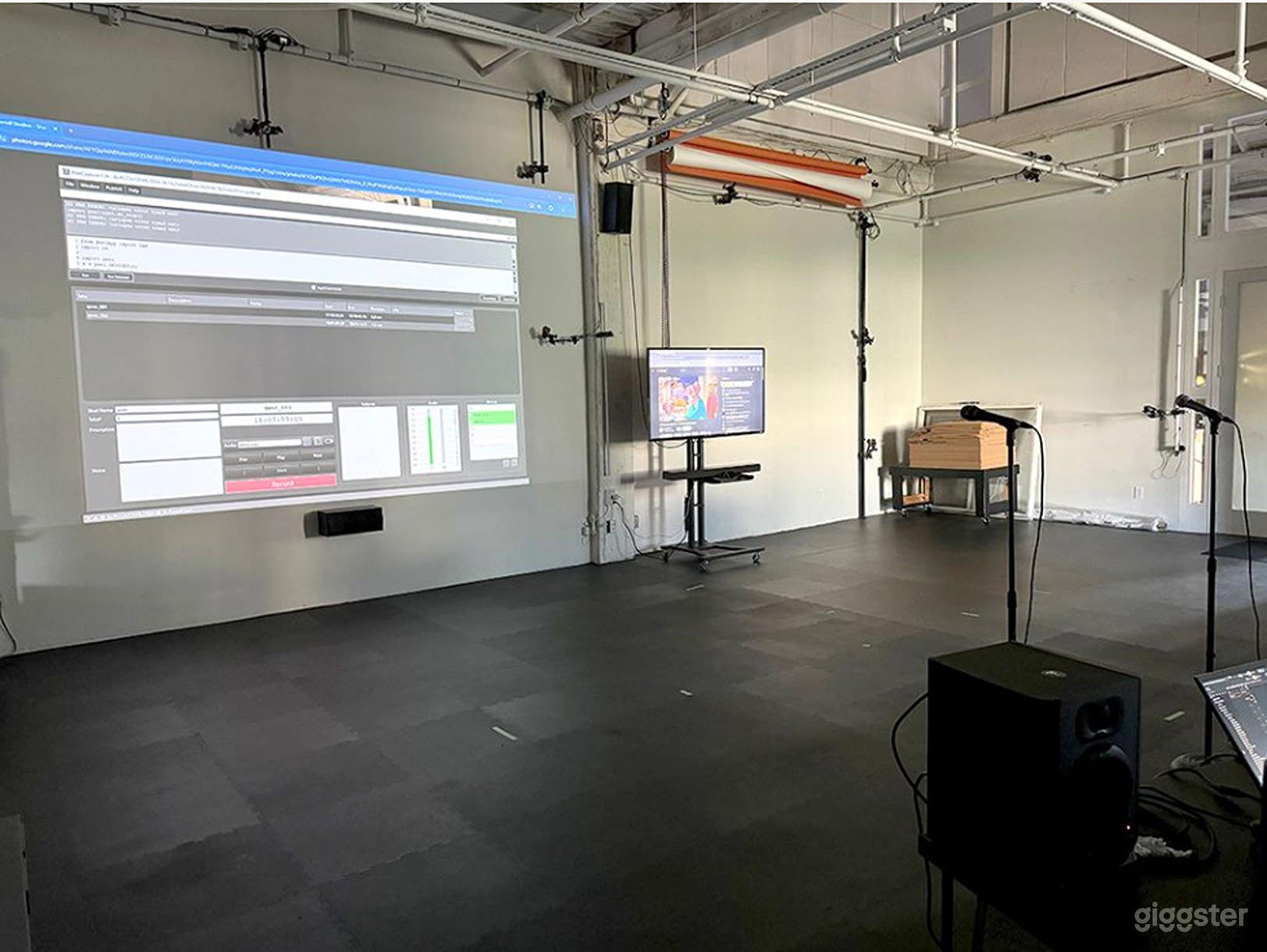 Open Studio area with projection of computer image (full size projection is 18 ft diagonal). Rubber flooring, ceiling grid for lighting