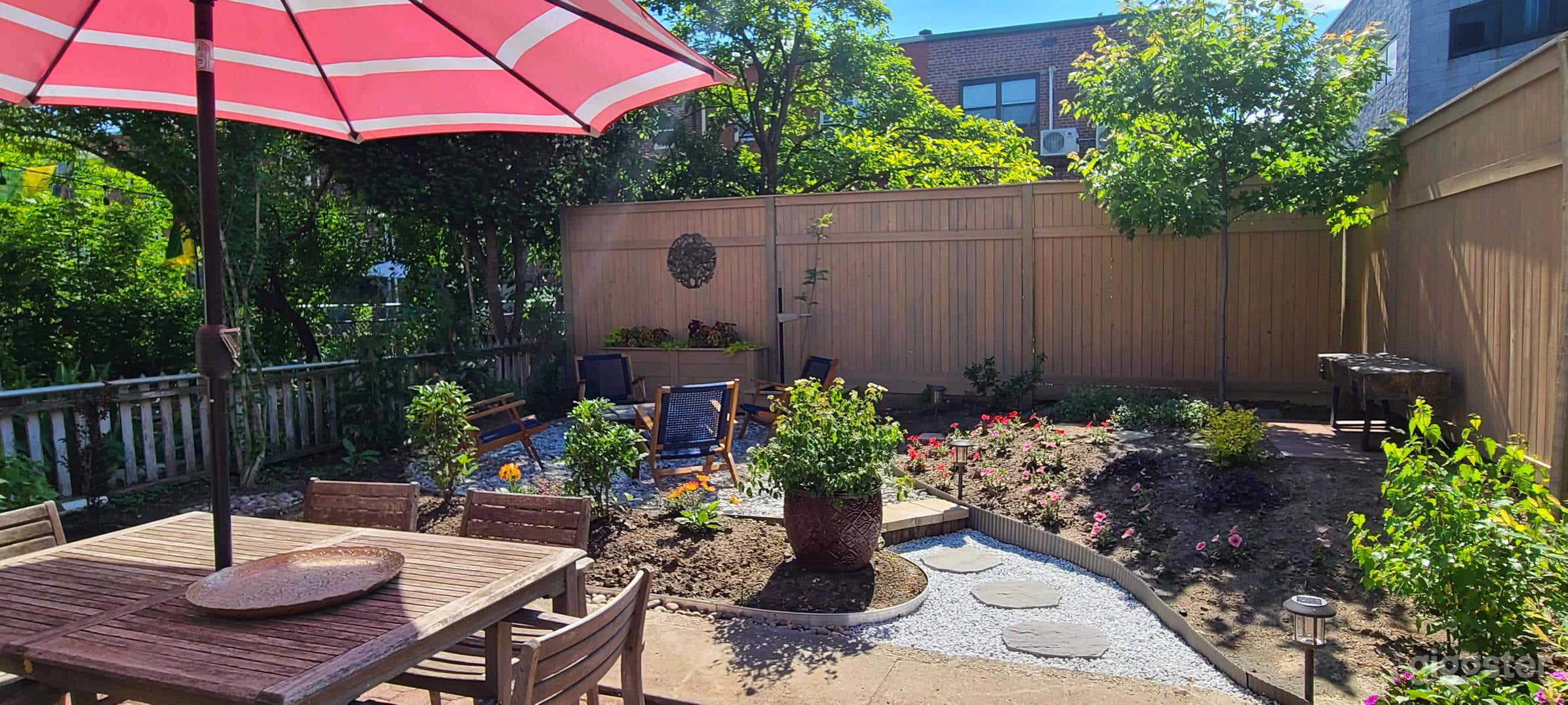 Spacious, landscaped backyard with multiple seating areas