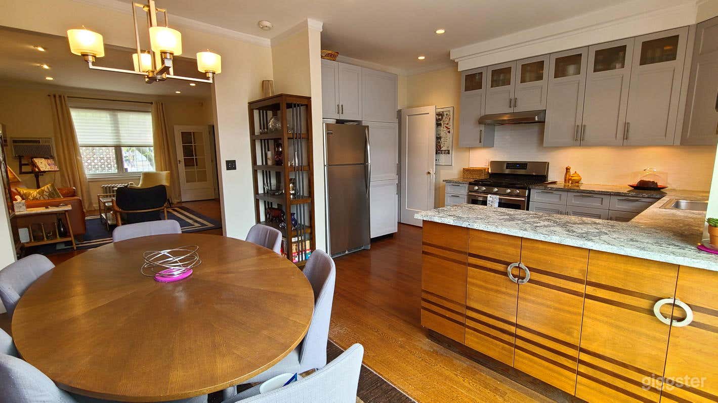 Open first floor dining/living/kitchen with midcentury furnishings, 9' ceilings