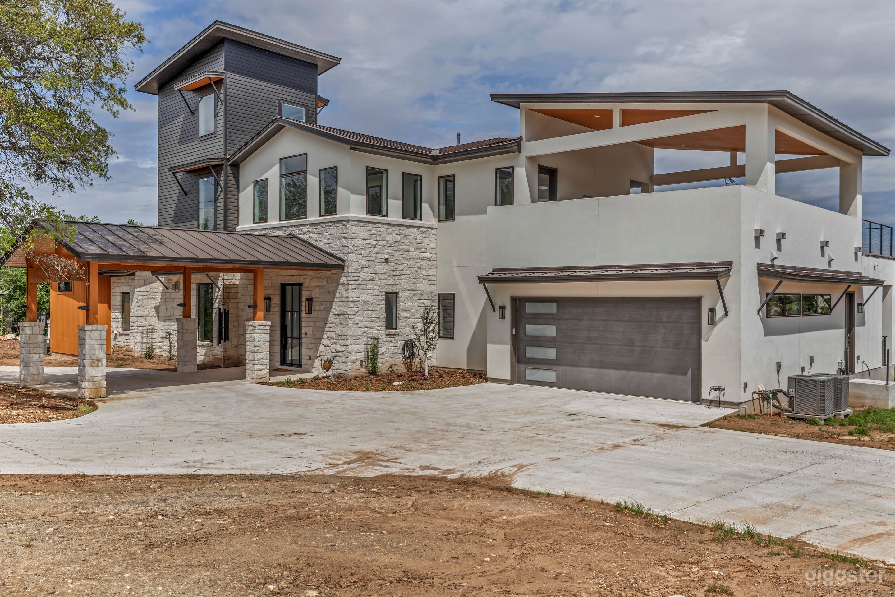 Modern house with circle drive entry, plenty of parking, has since been landscaped.