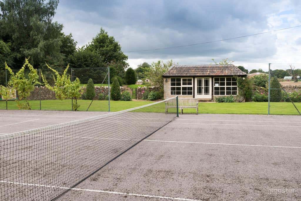 Spacious and Relaxing Tennis Court Photo 1
