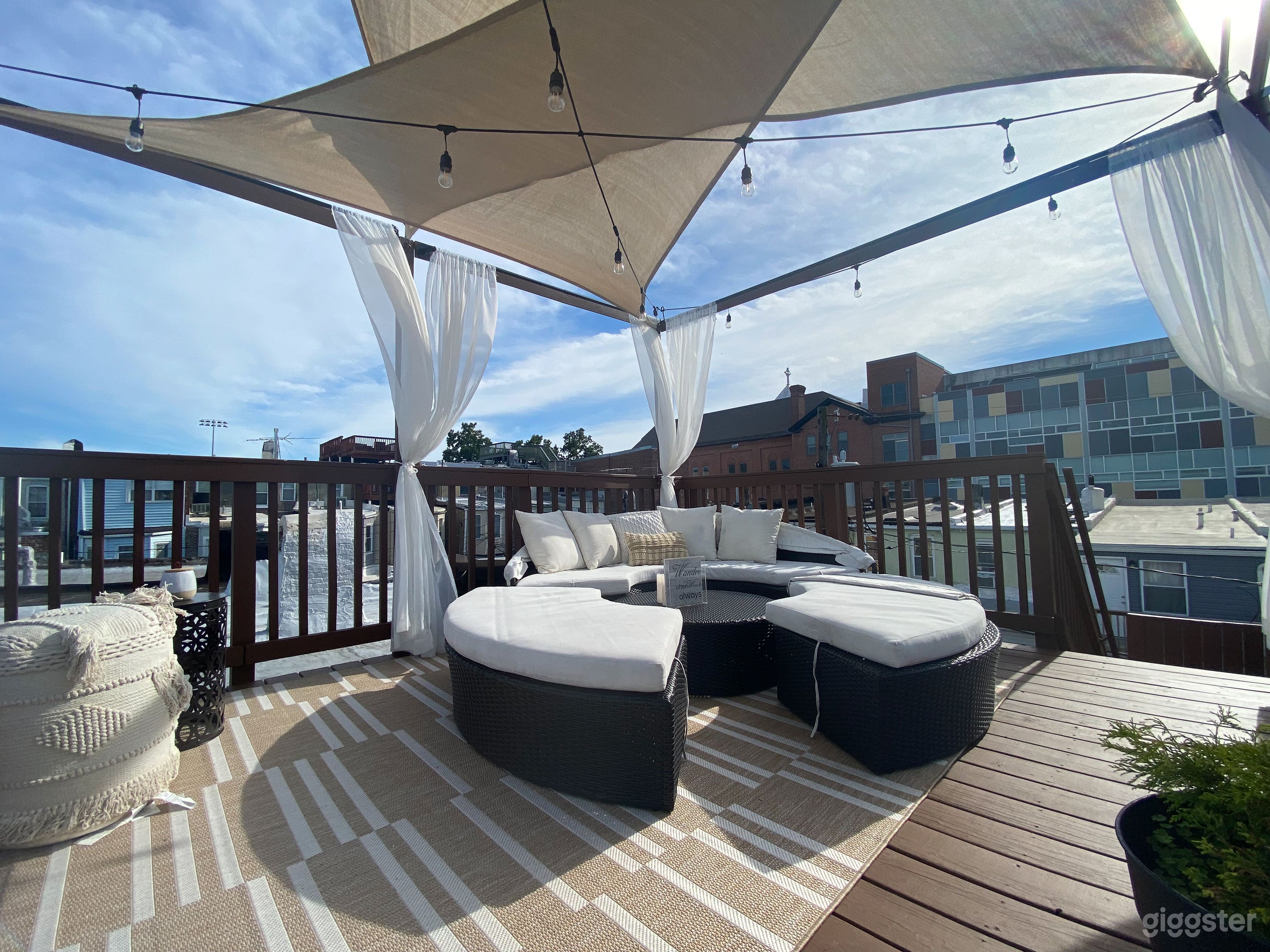Cabana style rooftop deck with city views features luxury daybed (now with option to cover with heated tent!)