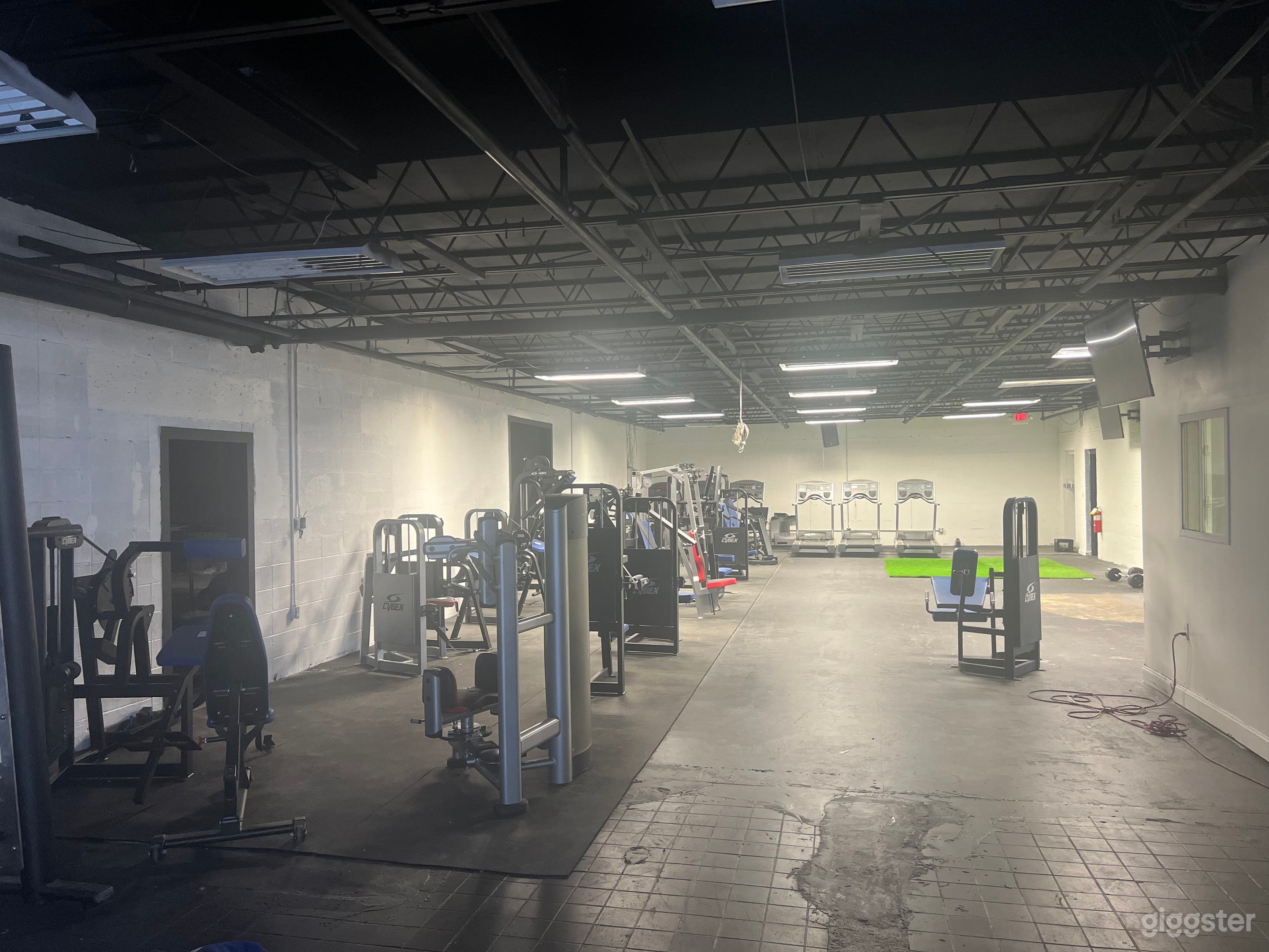 There are multiple areas for fitness aesthetics and usage, including the main boxing area with boxing ring and an open space. 