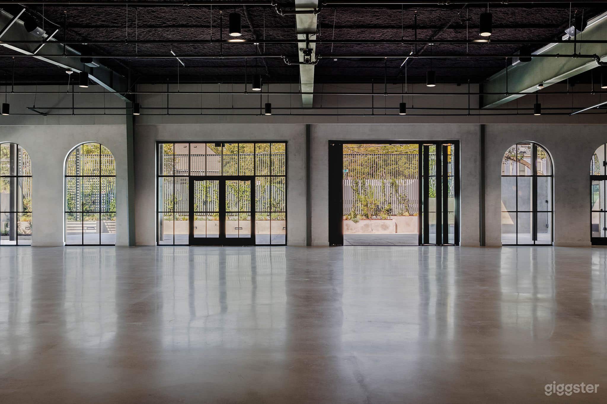 Modern Industrial Hall with Natural Light Photo 4