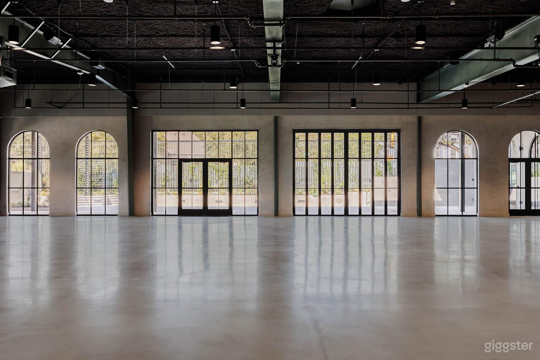 Modern Industrial Hall with Natural Light Photo 3