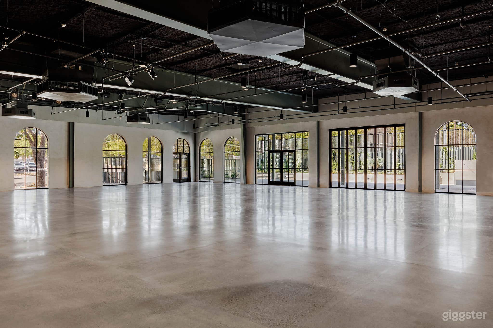 Modern Industrial Hall with Natural Light Photo 1