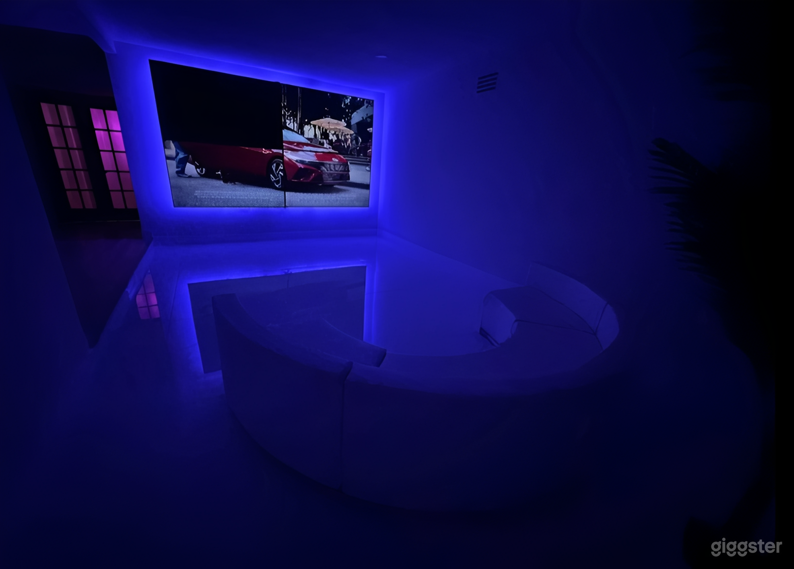 Modern White Event Space with LED TV Wall Photo 4