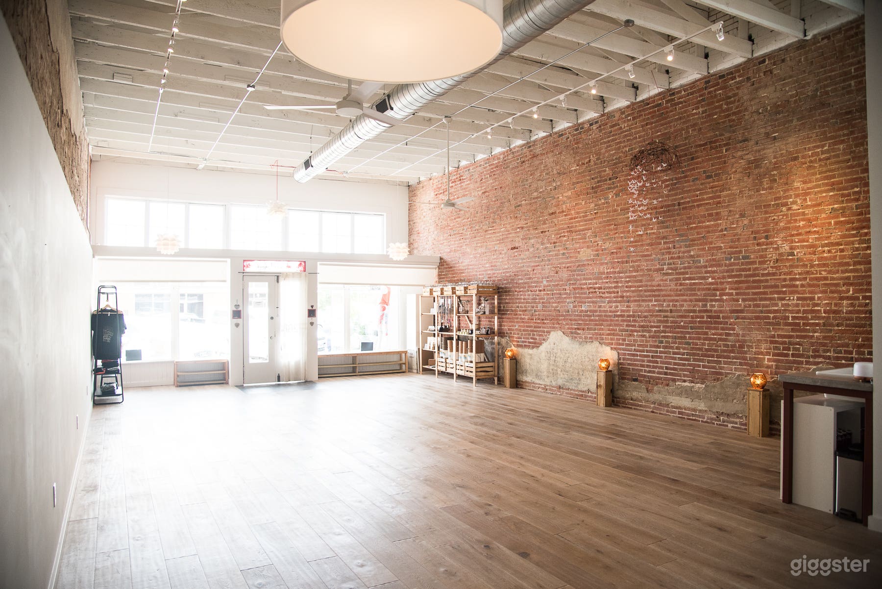 Wood floor, exposed brick, high ceilings natural light