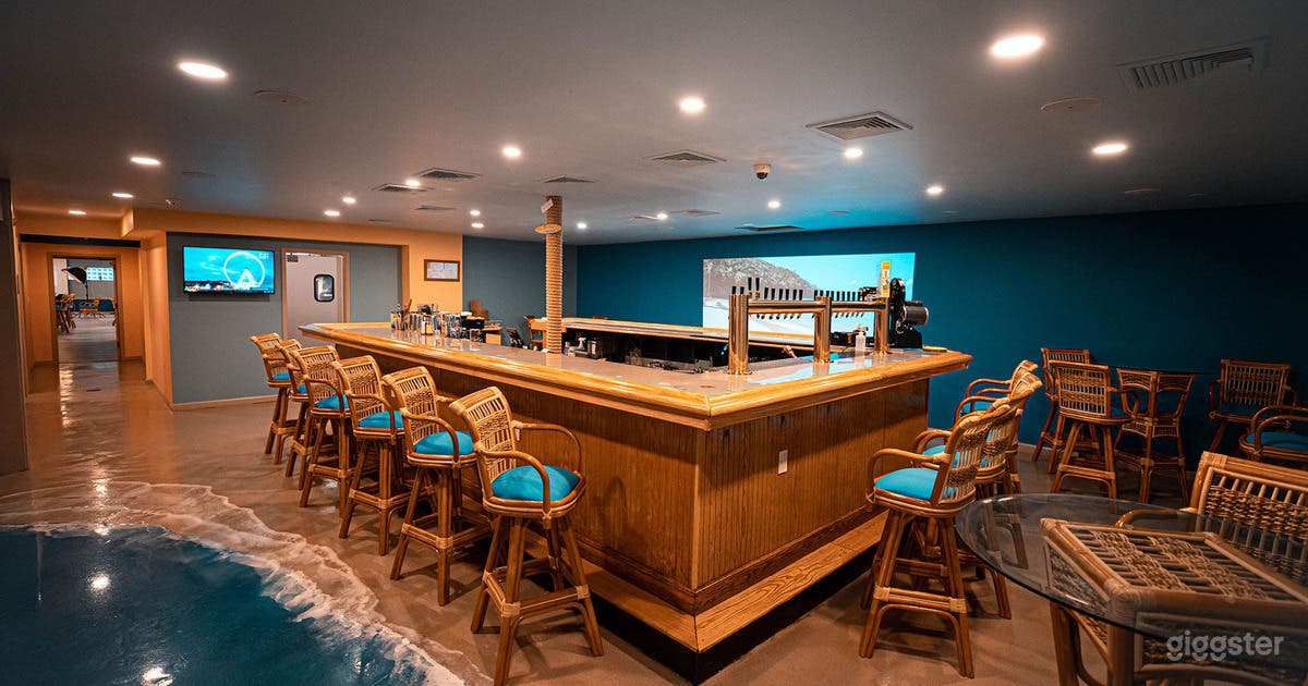 Cabana bar located in the event space.  A little bit of the shoreline is showing on the floor.