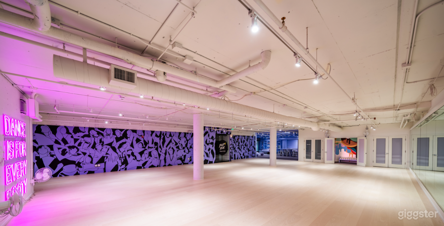 Studio Biggie has a 3,000 sq ft, clean wooden floor with mural, neon sign and one full wall of mirrors.