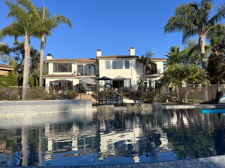  Morning light on back of house with pool. 