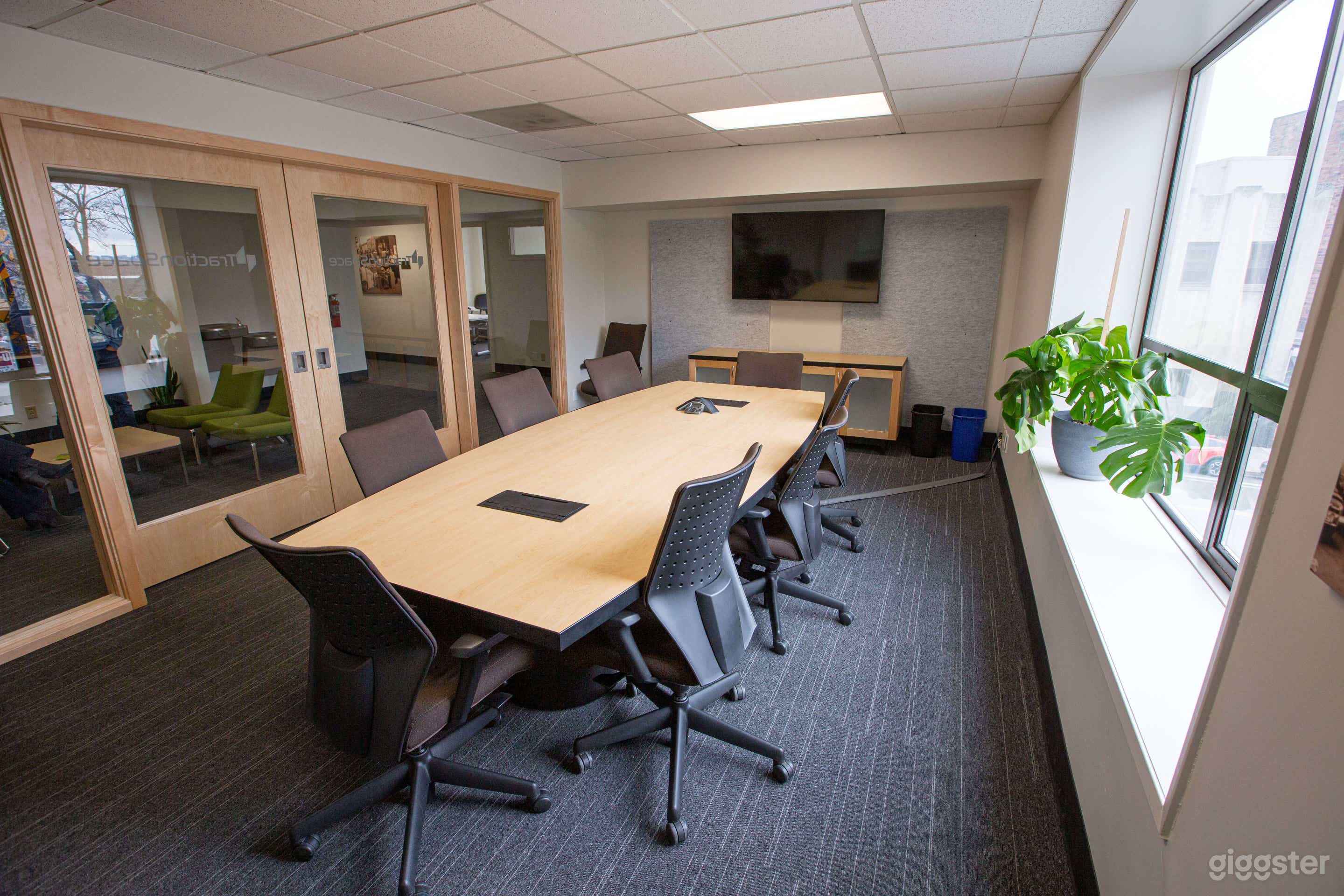 Our ‘Board Room’ caliber conference room suitable for formal meetings. Its large picture windows fill the space with light but the glass ‘barn doors’ give it an air of sophistication.  This is located on the second floor and is ADA accessible!