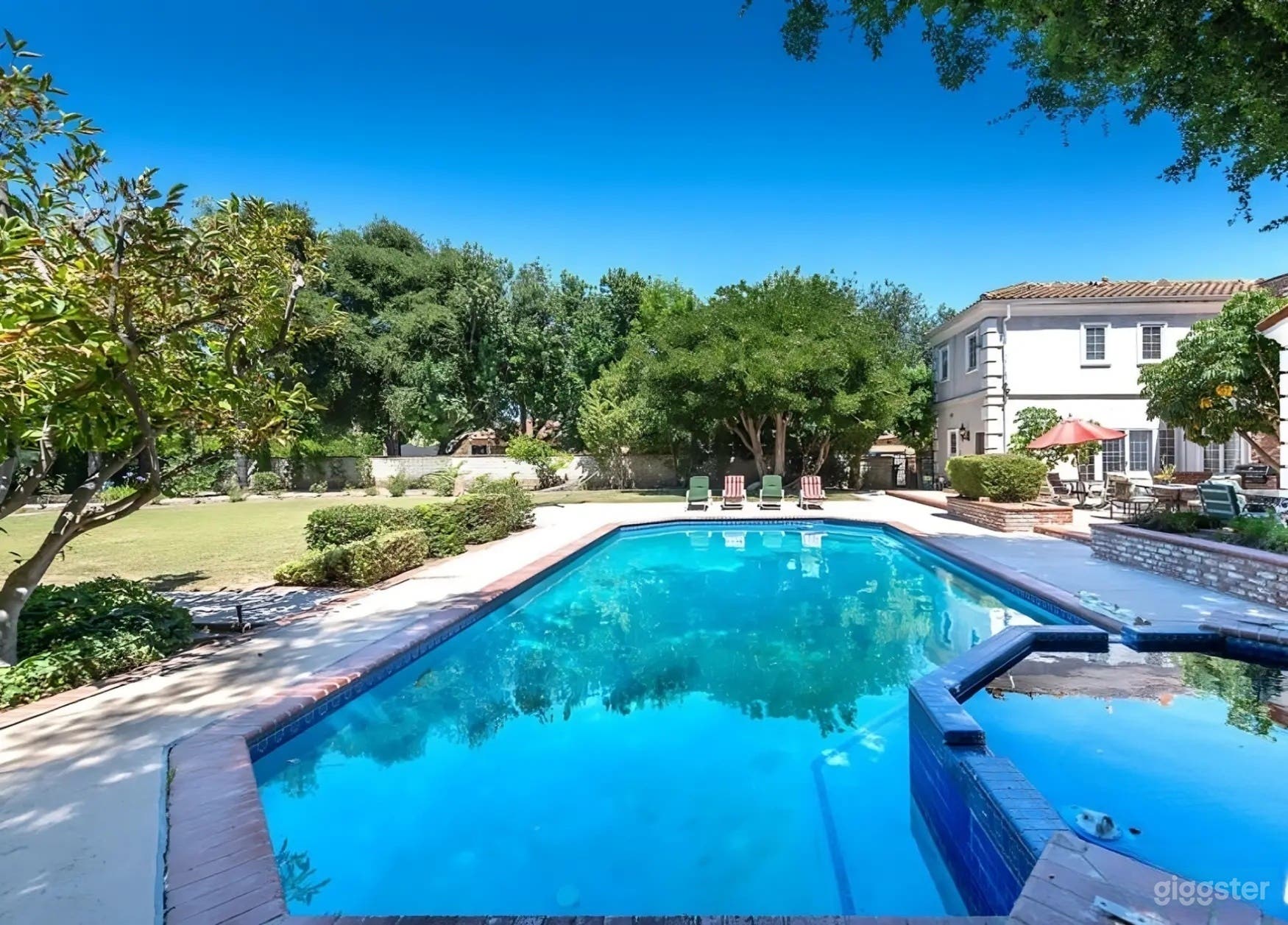 OUTDOOR POOL | GRAND TRADITIONAL ESTATE Photo 3